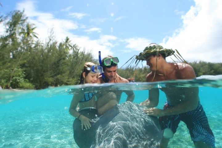 a man and woman swimming in the water